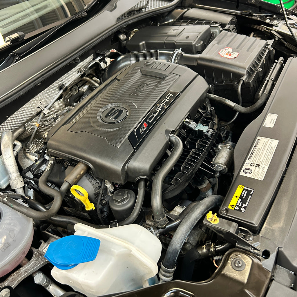 Car engine compartment with visible brand logo